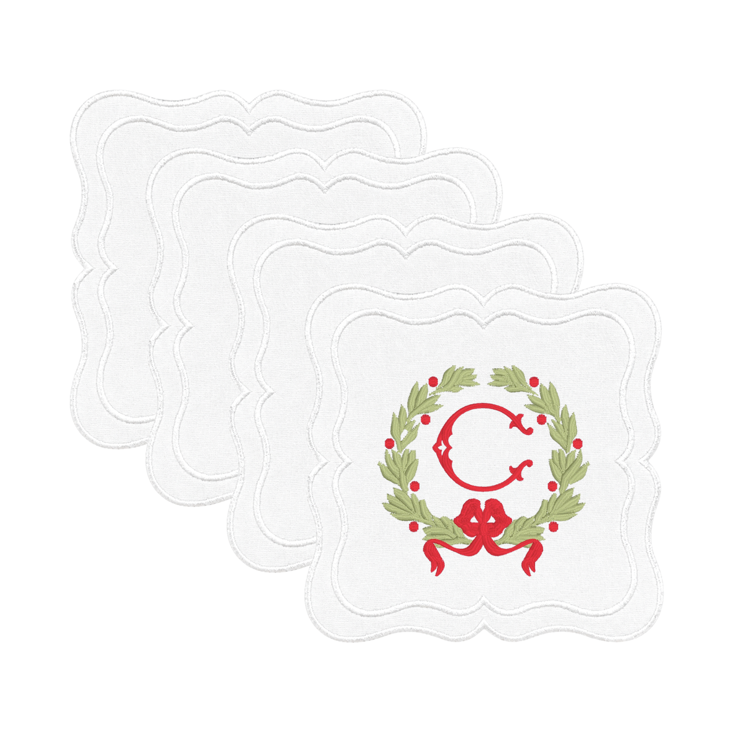 Holiday napkin with laurel wreath monogram, red berries, and ribbon bow
