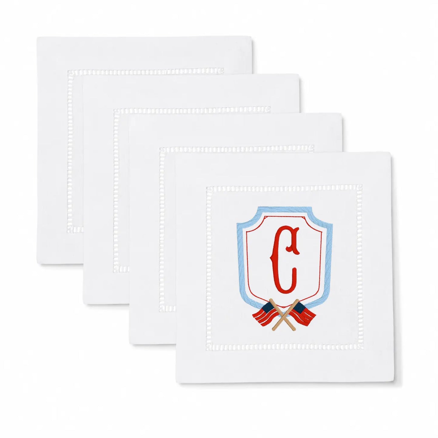 Set of americana crest monogram cocktail napkins with personalized embroidery for entertaining