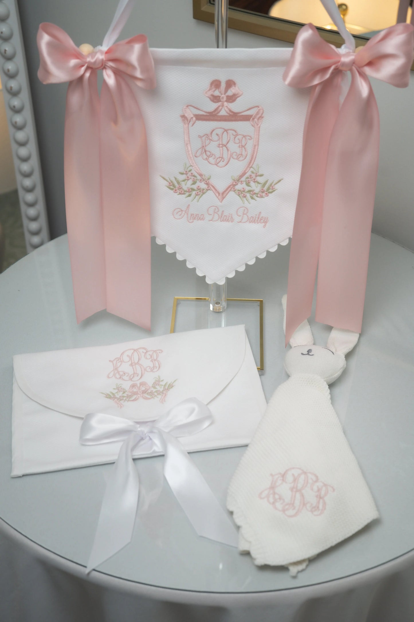 Personalized victorian name banner, keepsake bag, and lovey bundle with embroidered monogram and ribbon