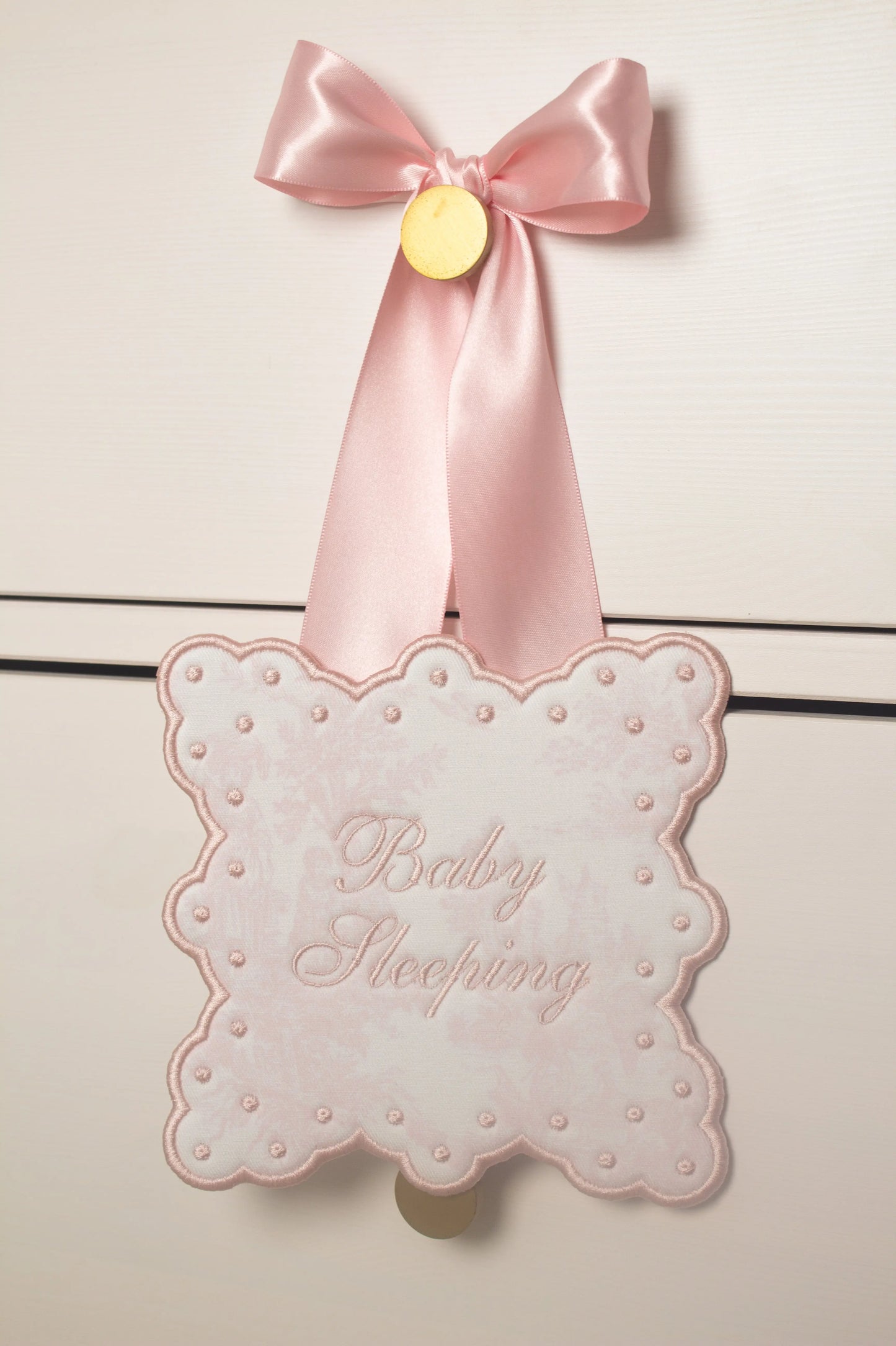 Personalized toile sleeping baby door sign with custom embroidery from Saul Stitch House; embroidery detail