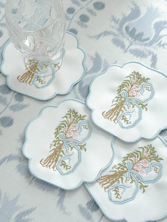 Set of romantic monogram coasters with personalized embroidery for entertaining; styled view