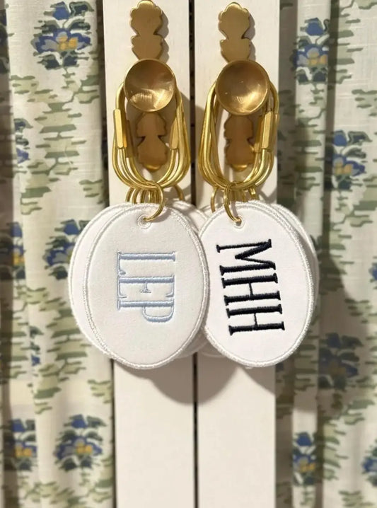 Personalized monogram bag charm keychain with custom embroidery from Saul Stitch House; styled view