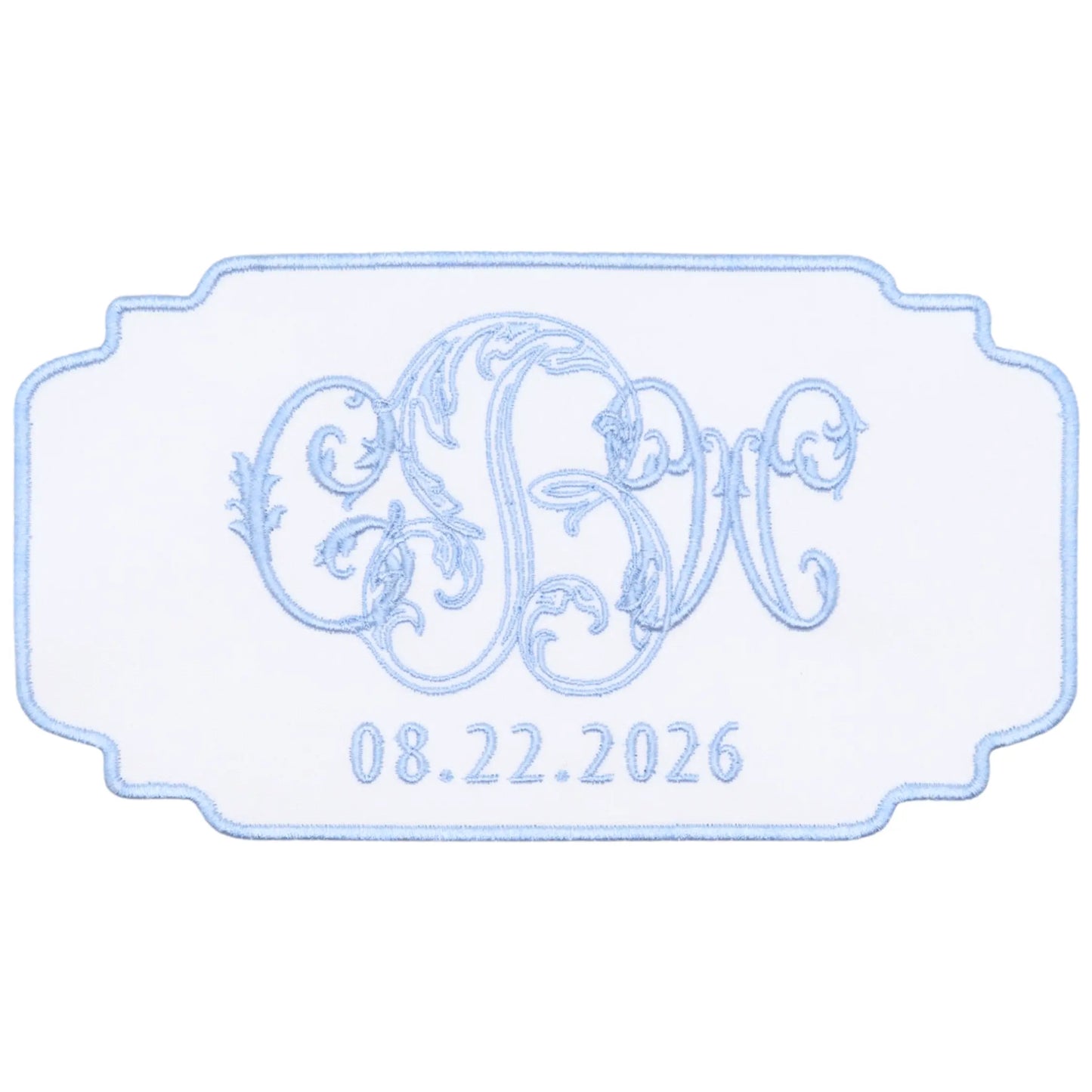 Custom magnolia bouquet wrap with embroidered monogram and wedding date for a bridal bouquet