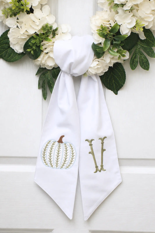 Personalized harvest heirloom wreath sash with embroidered motif for a decorative front door wreath; styled view