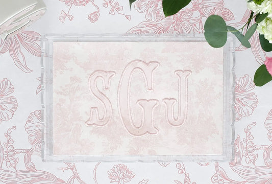 Clear scalloped acrylic nursery tray with pink toile fabric and embroidered SGJ appliqué monogram