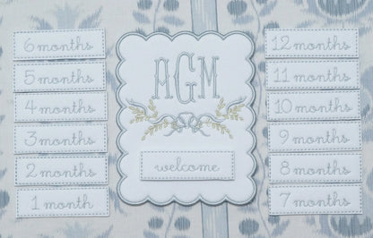 Personalized bennett monthly milestone plaque with embroidered monogram for baby milestone photos; styled view