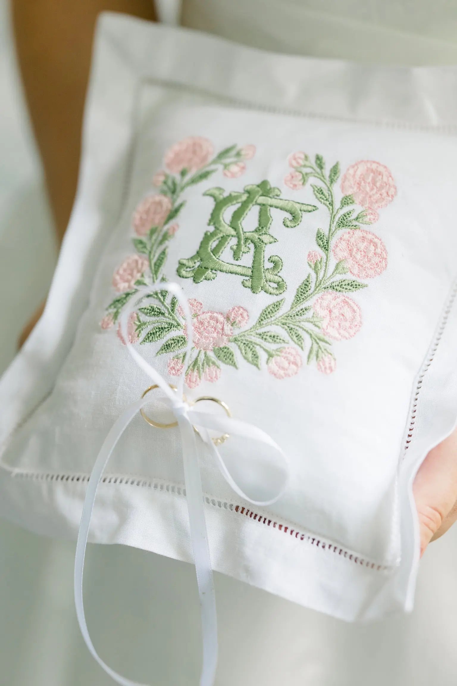 Custom wedding ring pillow with embroidered monogram for the ceremony; styled view