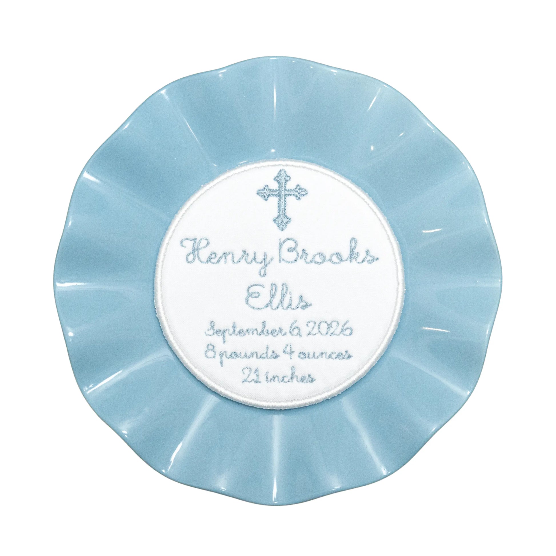 Personalized birth stats plated medallion with custom embroidery from Saul Stitch House
